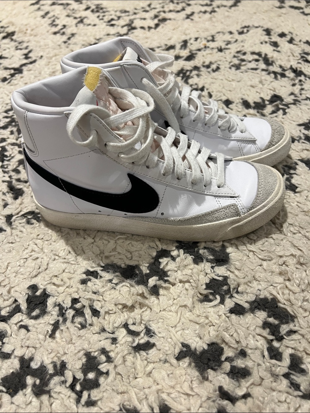 Nike Blazers White High-Top Sneakers with Black Swoosh and Yellow Tongue Accent